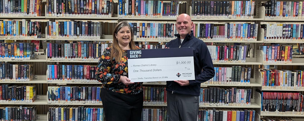 Shelby presents the MSGCU Giving Back donation check